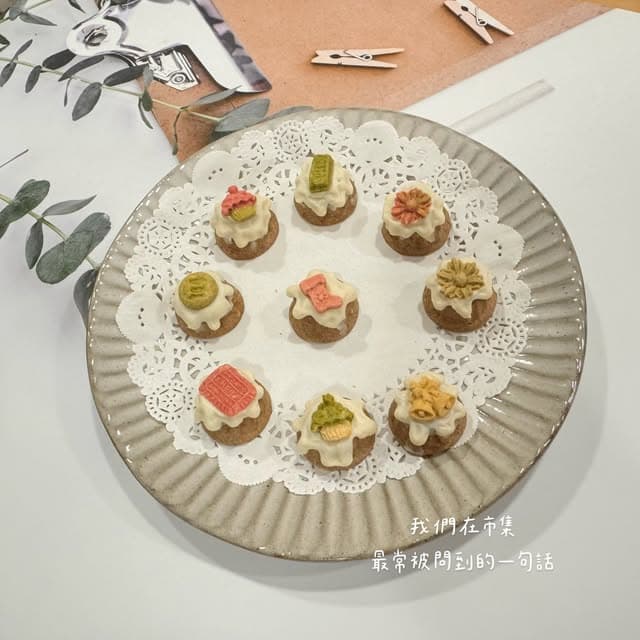 A plate of decorative small cakes, not identifiable with brand or product features.