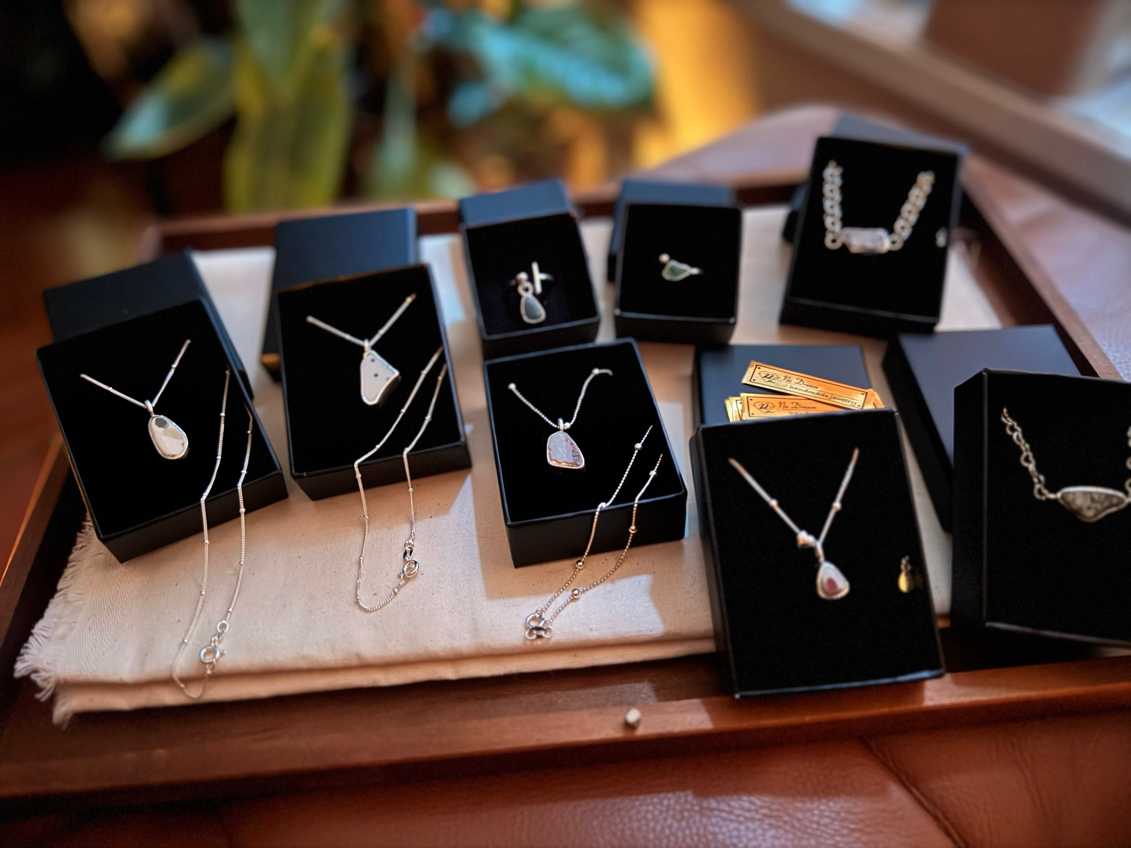 The image shows several jewelry boxes and necklaces, unrelated to Bao Feng Soap.