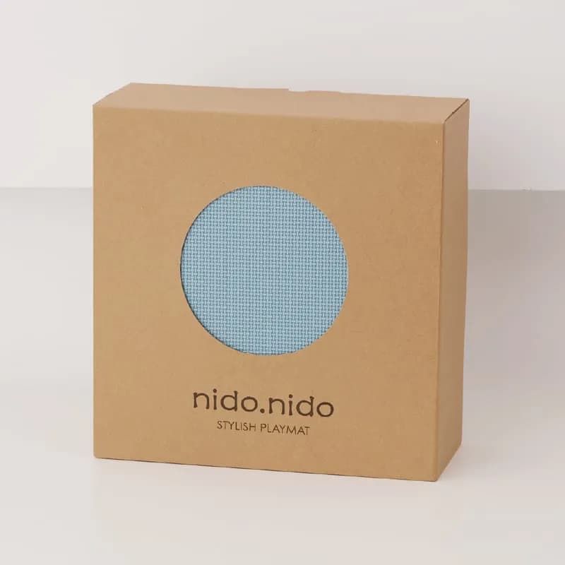 NIDO NIDO 的時尚遊戲墊包裝,簡約設計。